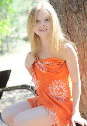 18 year old girl Katie Lewis stands naked after undressing in her bedroom